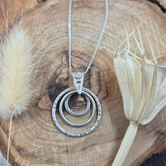 Handmade Sterling Silver Pendant Necklace: Textured Rings Charm Jones Stones